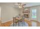 Cozy dining room with a table, hardwood floors, and a fireplace at 110 Clubhouse Rd, Summerville, SC 29483