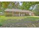 Charming brick home featuring a well-maintained lawn and inviting front porch at 110 Clubhouse Rd, Summerville, SC 29483