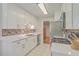 Modern kitchen with quartz counters, white cabinets, and stainless steel appliances at 110 Clubhouse Rd, Summerville, SC 29483