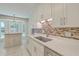 Bright kitchen with updated cabinets, stylish backsplash, and bay window eating area at 110 Clubhouse Rd, Summerville, SC 29483