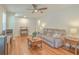 Cozy living room with hardwood floors, a ceiling fan, and stylish furnishings at 110 Clubhouse Rd, Summerville, SC 29483