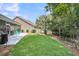 Backyard with covered patio, outdoor seating, manicured lawn and fence at 1115 Old Field Dr, Summerville, SC 29483