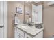 Bright bathroom featuring a granite countertop and a large framed mirror on the wall at 1115 Old Field Dr, Summerville, SC 29483