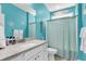 Stylish bathroom with a white vanity, granite countertop, and beach-themed decorations at 1115 Old Field Dr, Summerville, SC 29483