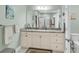 Bright bathroom with double sink vanity, granite counters and modern fixtures at 1115 Old Field Dr, Summerville, SC 29483