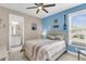 Comfortable bedroom with nautical decor, ceiling fan, and natural light for a serene retreat at 1115 Old Field Dr, Summerville, SC 29483