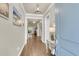 Bright foyer with hardwood flooring, neutral walls, decorative lighting, and a glimpse of the living area at 1115 Old Field Dr, Summerville, SC 29483