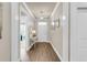 Elegant foyer featuring hardwood floors, crown molding, a console table, and artwork at 1115 Old Field Dr, Summerville, SC 29483
