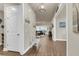 Inviting hallway with wood floors and decor leading to the living room at 1115 Old Field Dr, Summerville, SC 29483