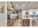 Spacious kitchen featuring a large island with seating, stainless steel appliances, and modern lighting at 1115 Old Field Dr, Summerville, SC 29483
