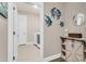 Charming laundry room with beach decorations and modern appliances, enhancing home organization at 1115 Old Field Dr, Summerville, SC 29483
