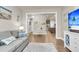 Cozy living room flowing into the kitchen featuring a comfortable couch and beachy accents at 1115 Old Field Dr, Summerville, SC 29483