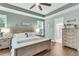 Charming main bedroom with hardwood floors, ceiling fan and serene color scheme at 1115 Old Field Dr, Summerville, SC 29483