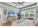 Relaxing main bedroom showcasing a trey ceiling, ceiling fan and workout area at 1115 Old Field Dr, Summerville, SC 29483