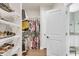 Spacious walk-in closet featuring ample shelving and a connection to the bathroom at 1115 Old Field Dr, Summerville, SC 29483