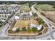 Aerial view of the community center, showing its open lawns, sidewalks, greenery, and various community buildings at 1136 Kane Blue, Summerville, SC 29485