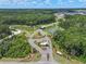 Idyllic aerial view of the community entrance, featuring serene lakes with fountains and lush green landscaping at 1136 Kane Blue, Summerville, SC 29485