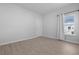 Neutral bedroom featuring wood floors, white walls and trim, large window and walk in closet at 1136 Kane Blue, Summerville, SC 29485