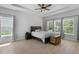 Bright bedroom with tray ceiling, a queen-sized bed, and many windows that fill the space with light at 1136 Kane Blue, Summerville, SC 29485