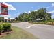 Community entrance featuring a decorative gate, lush landscaping, and signage welcoming residents and visitors at 1136 Kane Blue, Summerville, SC 29485