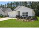 Well maintained front yard showing home's garage, and partial stone facade at 1136 Kane Blue, Summerville, SC 29485