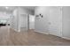 Hallway with wood floors and white doors creates a bright, clean aesthetic at 1136 Kane Blue, Summerville, SC 29485