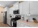 Modern kitchen featuring white cabinets, stainless steel appliances, and light quartz countertops at 1136 Kane Blue, Summerville, SC 29485