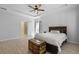 Open bedroom with tray ceiling, hardwood floors, and a door to the bathroom with glass shower at 1136 Kane Blue, Summerville, SC 29485