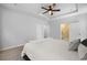 Bright main bedroom featuring a ceiling fan, tray ceilings, and access to the main bathroom at 1136 Kane Blue, Summerville, SC 29485