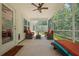 Relaxing screened porch with fan and comfortable patio seating, perfect for outdoor enjoyment at 1136 Kane Blue, Summerville, SC 29485