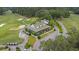 Aerial view of golf clubhouse featuring a covered porch and beautiful landscape at 114 Marshside Dr, Summerville, SC 29485