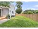 Spacious backyard featuring lush green grass and a wooden privacy fence at 114 Marshside Dr, Summerville, SC 29485