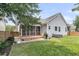 Large backyard featuring a screened porch, privacy fence, and ample green space at 114 Marshside Dr, Summerville, SC 29485