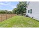 Wide backyard featuring a privacy fence and green lawn at 114 Marshside Dr, Summerville, SC 29485