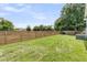 Large backyard features a wooden privacy fence and green lawn at 114 Marshside Dr, Summerville, SC 29485