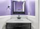 Bathroom featuring black vanity, light countertops, and modern sink fixture at 114 Marshside Dr, Summerville, SC 29485