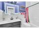 Charming bathroom with black vanity, illuminated mirror, and subway tile shower at 114 Marshside Dr, Summerville, SC 29485