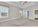 Spacious bedroom with carpeted floor and multiple windows allowing natural light at 114 Marshside Dr, Summerville, SC 29485