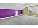 Unfinished bonus room with vaulted ceiling, gray carpet, and colorful walls with window at 114 Marshside Dr, Summerville, SC 29485