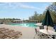 Beautiful community pool with lounge chairs and shade umbrellas for relaxation at 114 Marshside Dr, Summerville, SC 29485