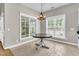 Charming dining area with lots of natural light and modern light fixture at 114 Marshside Dr, Summerville, SC 29485