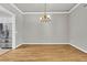 Dining room featuring hardwood floors, crown molding, and chandelier at 114 Marshside Dr, Summerville, SC 29485