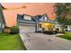Beautiful two-story home featuring an attached garage and a welcoming front porch at 114 Marshside Dr, Summerville, SC 29485