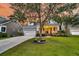 Beautifully landscaped front yard and charming two-story home at dusk at 114 Marshside Dr, Summerville, SC 29485