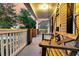 Inviting front porch featuring a cozy wooden porch swing for relaxation at 114 Marshside Dr, Summerville, SC 29485