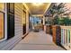 Charming front porch with a swing, perfect for enjoying the evening at 114 Marshside Dr, Summerville, SC 29485