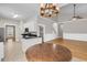 Bright kitchen features granite countertops, stainless steel appliances, and wood floors at 114 Marshside Dr, Summerville, SC 29485