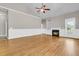 Bright, open living room with hardwood floors, fireplace, and neutral paint at 114 Marshside Dr, Summerville, SC 29485