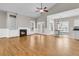 Spacious living room with a fireplace, hardwood floors, and a view into the dining area at 114 Marshside Dr, Summerville, SC 29485
