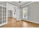 Spacious living room featuring hardwood floors, crown molding, and recessed lighting at 114 Marshside Dr, Summerville, SC 29485